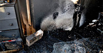 image of a burned room with space heater visible